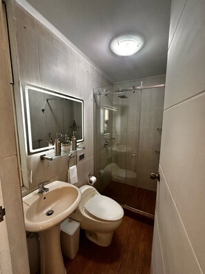 Shower, hair dryer, towels, soap