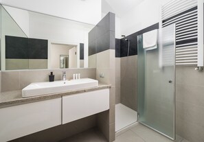 Shower, hair dryer, towels, soap