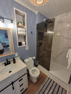 Shower, hair dryer, towels, soap