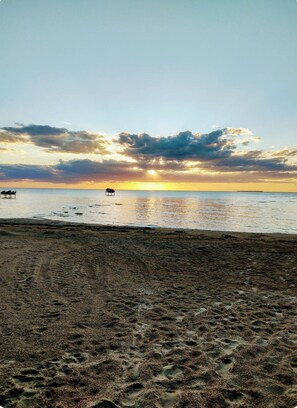 On the beach, sun loungers, beach towels