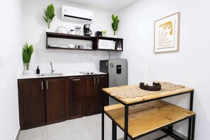 Fridge, microwave, stovetop, coffee/tea maker