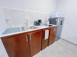 Fridge, microwave, stovetop, coffee/tea maker