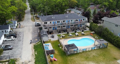 Lakefront condo steps to the beach with pool, and fireplace