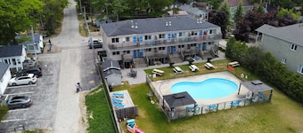 Lakefront condo steps to the beach with pool, and fireplace