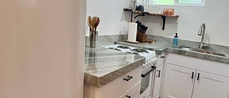 Fridge, coffee/tea maker, cookware/dishes/utensils