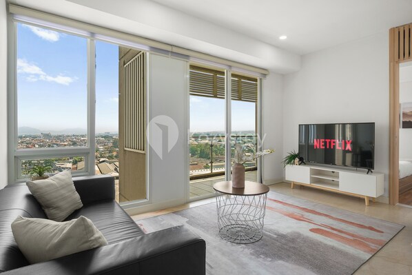 Apartment, 3 Bedrooms, City View | Living area | 55-inch Smart TV with cable channels, Netflix, streaming services