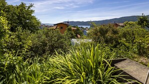A residential area with houses, greenery, and a clear sky.