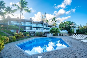 Tropical greenery surrounds this Napili Point pool, set just below private lanais for a quiet, easy-access swim anytime of day. - Napili Point | Oceanfront 5 BR, Sleeps 14 | Car Incl. w/ 6+ Nights | NAP ML-1301 by KBM (Lahaina)