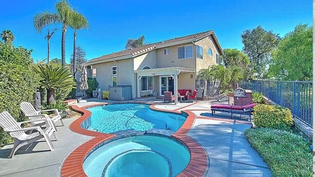 A house with a swimming pool and outdoor seating. - Mountain View • Pool House • BBQ (Chino Hills)