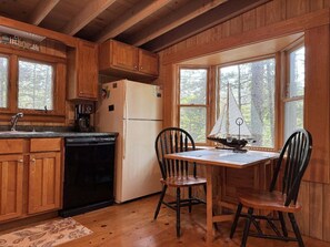 Fridge, microwave, oven, stovetop - Experience oceanfront tranquility at Phoebe's Nest, a cozy 3-bedroom cabin in East Boothbay. (East Boothbay)