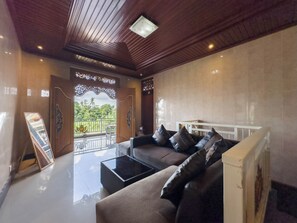 Chambre Deluxe | Coin séjour