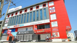 A building with multiple commercial units, including a Grand Banquet Hall and Reliance Digital. - Hotel M Grand (Hyderabad)
