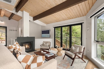 Soak in nature in this beautiful modern condo with mountain views