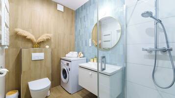 Shower, hair dryer, towels, soap