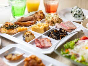 A meal tray with various dishes including sushi, sashimi, and a salad. - APA Hotel Tottori Ekimae (Tottori)