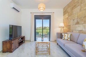 Glow 11 | Sala de estar | Smart TV de 50 pulgadas con canales por cable y servicios de streaming 