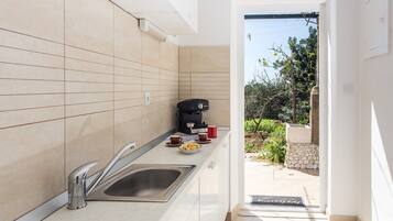 Fridge, stovetop, coffee/tea maker, toaster