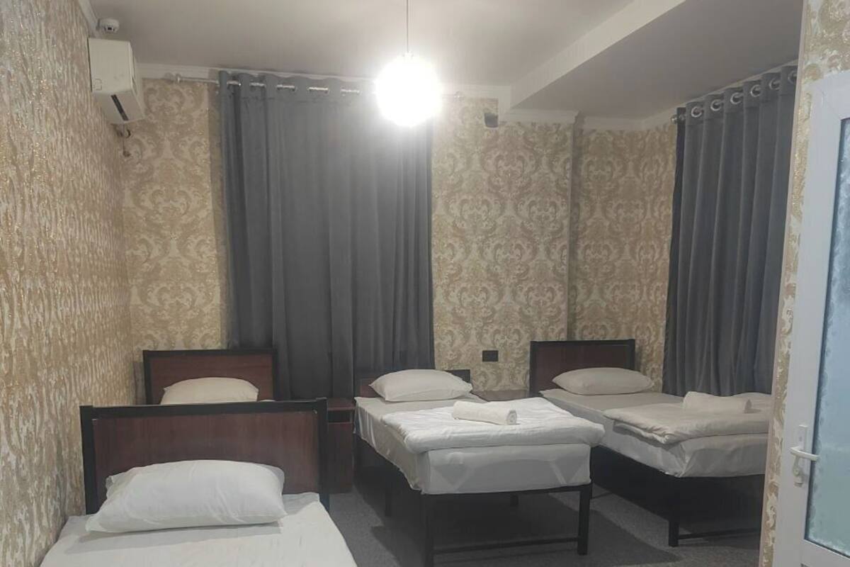 Quadruple Room | Living area | 52-inch flat-screen TV with digital channels