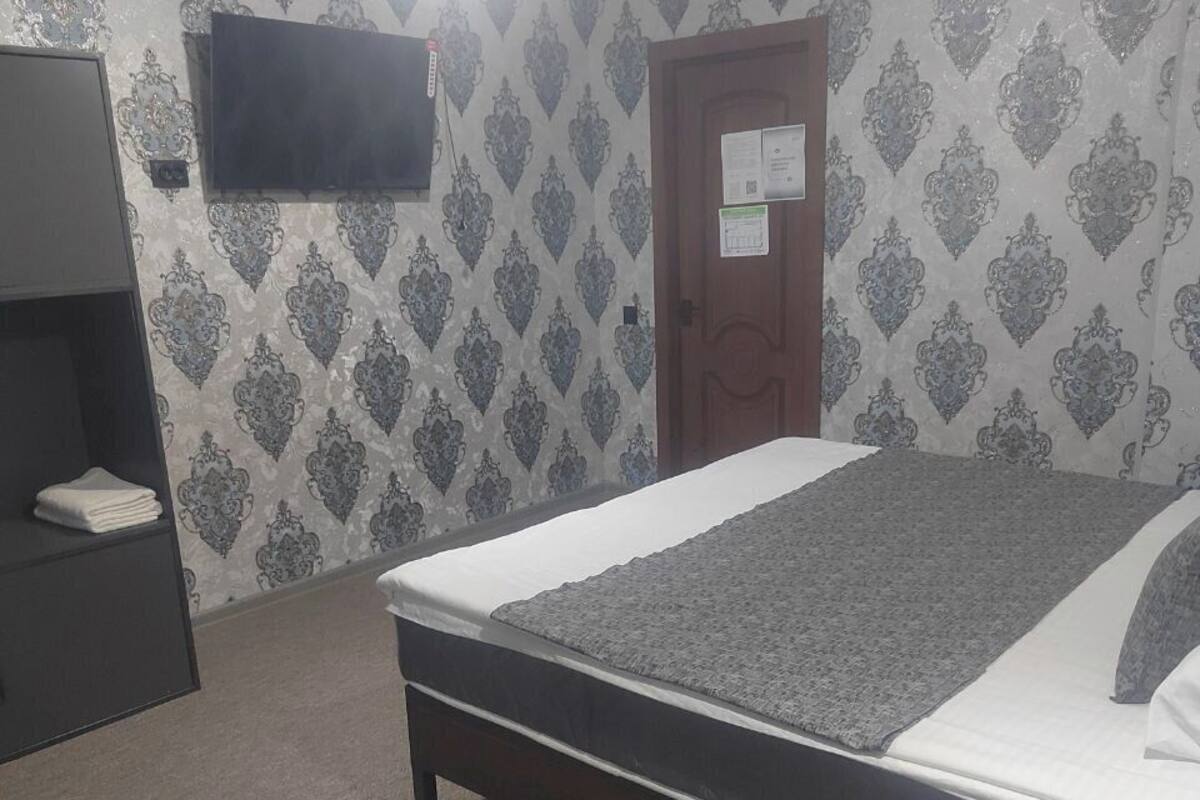 Luxury Double Room, City View | Living area | 52-inch flat-screen TV with digital channels