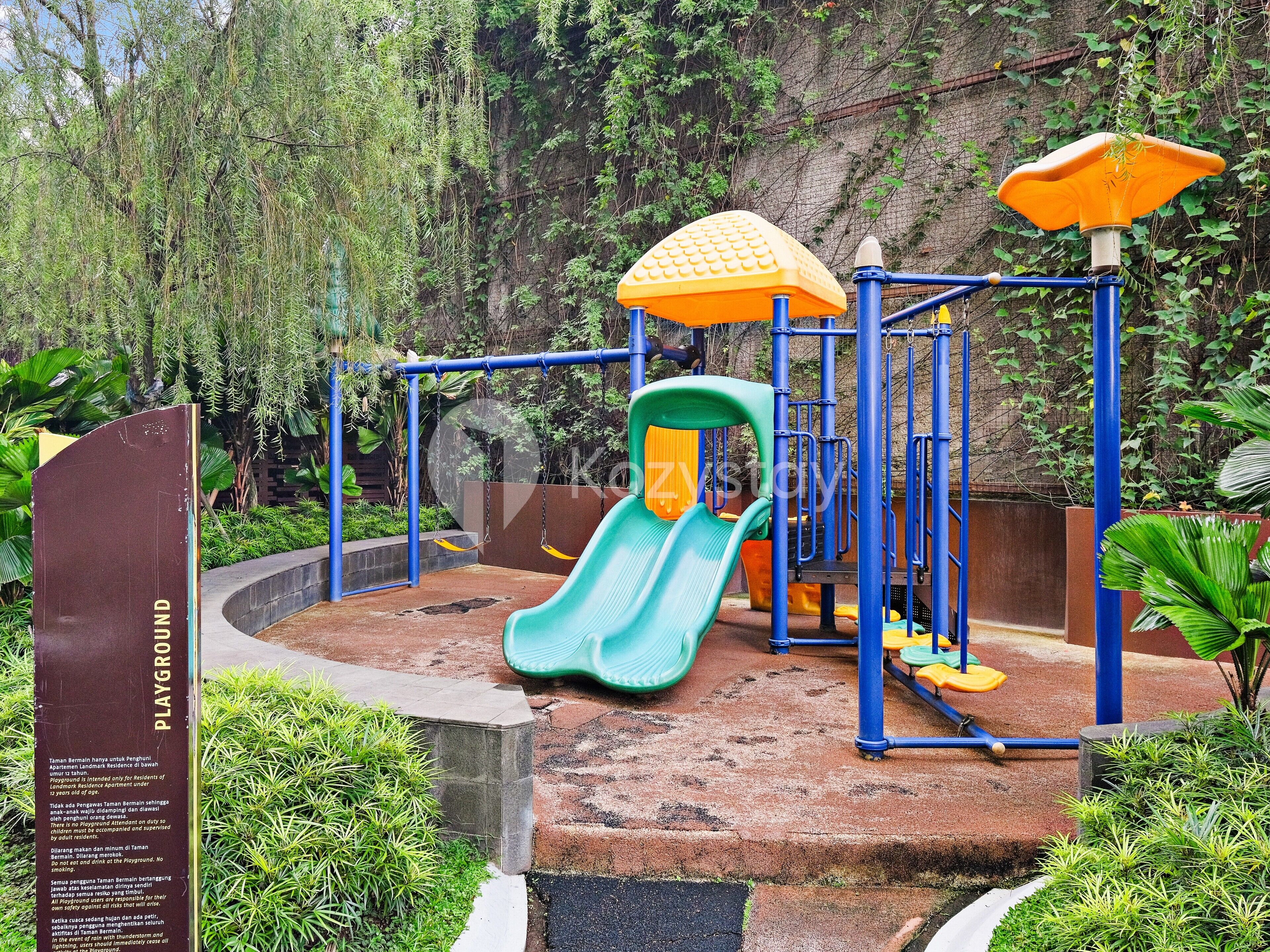 A playground with a slide, swings, and climbing structures.