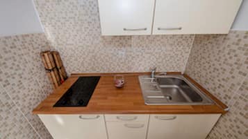 Fridge, stovetop, toaster, dining tables