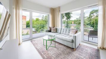 Apartment (A 15) | Living area | 30-inch flat-screen TV with satellite channels