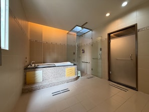 Separate tub and shower, hair dryer, slippers, towels