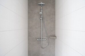Shower, towels, soap, toilet paper