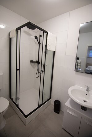 Shower, hair dryer, towels, soap
