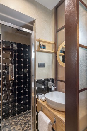 Family Apartment, Courtyard View | Bathroom | Shower, free toiletries, hair dryer, towels