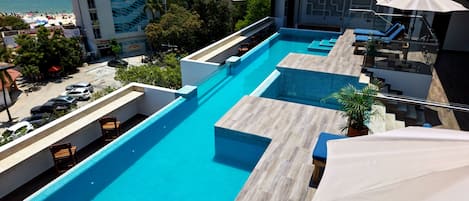 Outdoor pool, open 8:00 AM to 10:00 PM, pool umbrellas, pool loungers