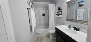 Hair dryer, towels, soap, toilet paper