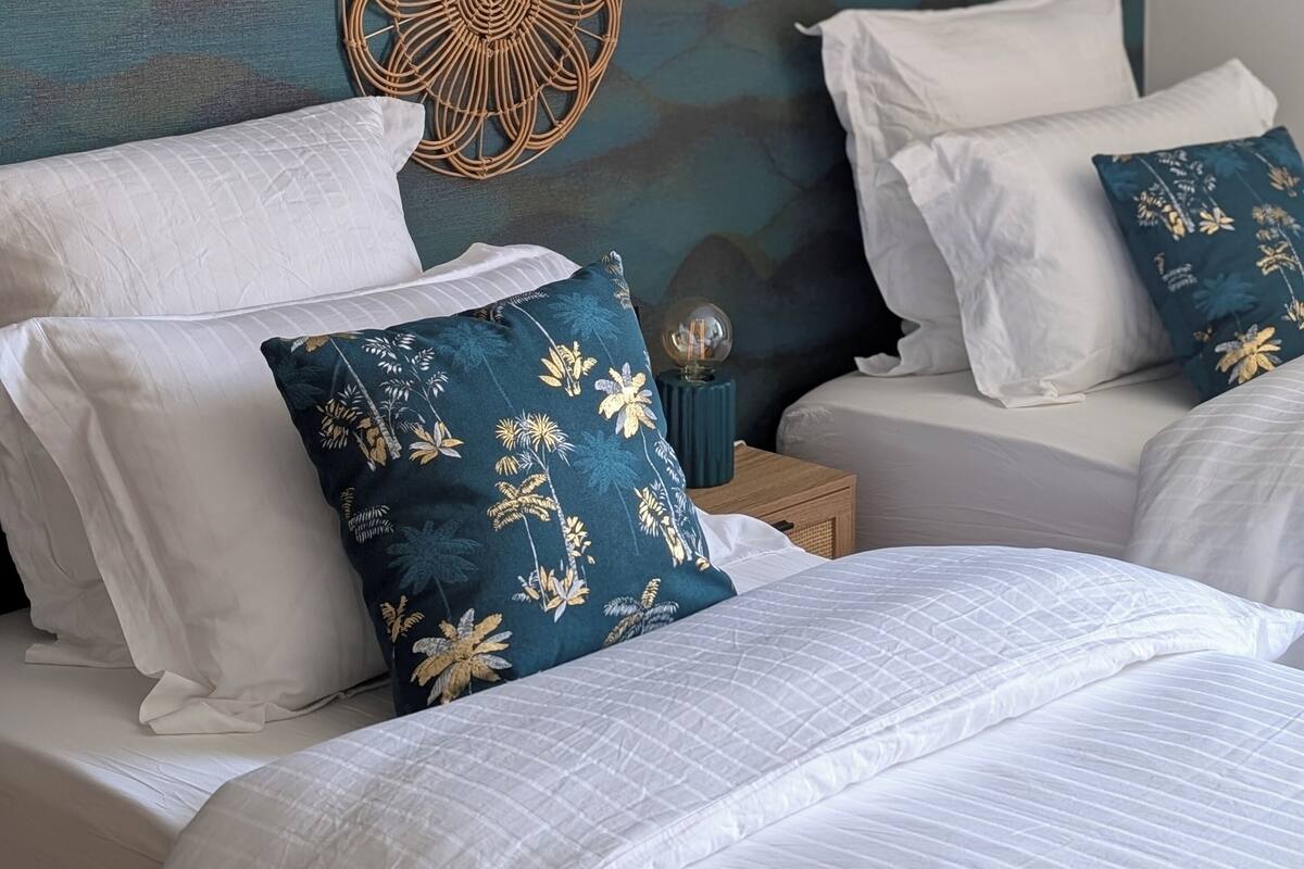 Premium bedding, pillow-top beds, desk, laptop workspace