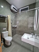 Shower, towels, soap, toilet paper