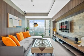 Appartement, 2 chambres, vue ville | Coin séjour | Télévision à écran plat