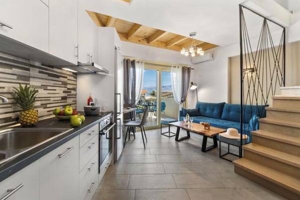 Deluxe Apartment, Sea View | Private kitchen | Full-sized fridge, oven, stovetop, electric kettle