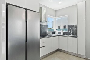 Fridge, microwave, stovetop, coffee/tea maker