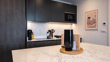 Apartment, 1 King Bed | Private kitchen | Microwave, oven, stovetop, dishwasher