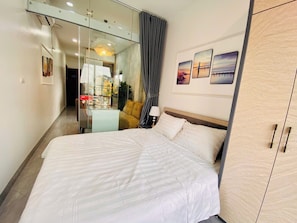 Deluxe Apartment, 1 Queen Bed, Balcony, City View | Desk, laptop workspace, blackout drapes, soundproofing - Lilo's Homestay (Hanoi)