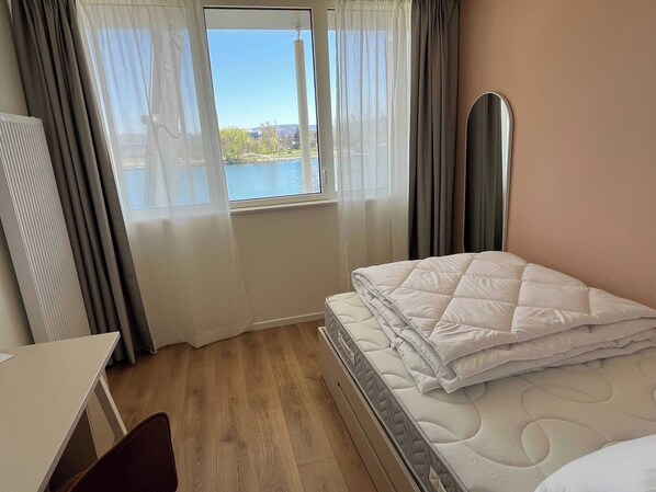 1 bedroom, laptop workspace, iron/ironing board, bed sheets