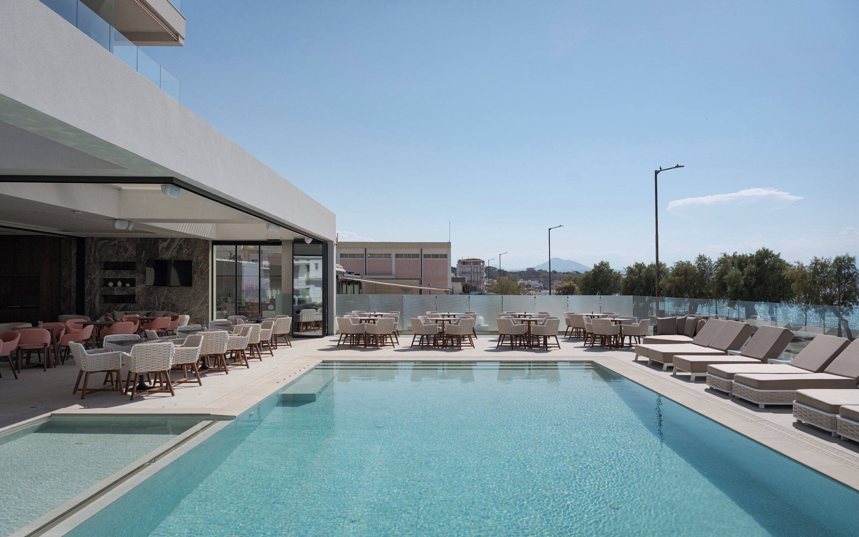 Outdoor pool, open 9:00 AM to 9:00 PM, pool umbrellas, pool loungers