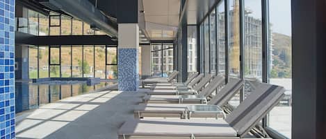 Indoor pool, seasonal outdoor pool, pool umbrellas, sun loungers