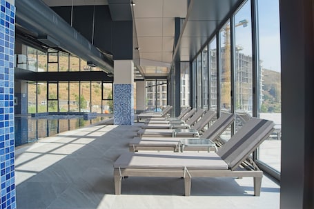 Indoor pool, seasonal outdoor pool, pool umbrellas, sun loungers