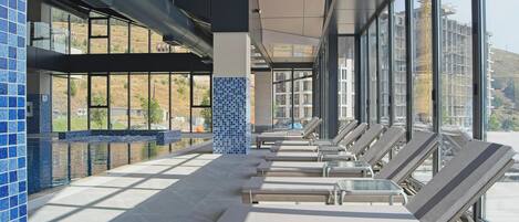 Indoor pool, seasonal outdoor pool, pool umbrellas, sun loungers