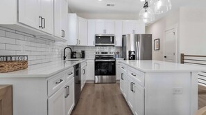 Fridge, microwave, oven, stovetop - Nellie’s Nest Summary (Carolina Beach)