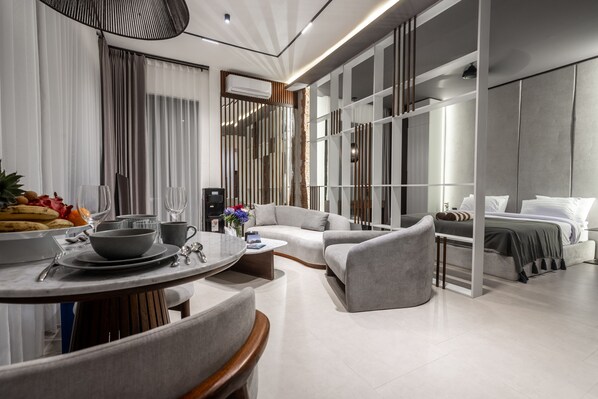 Studio, 1 King Bed, Balcony | Living area | 55-inch Smart TV with digital channels