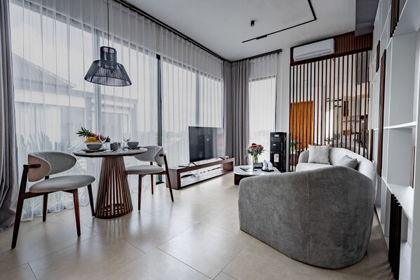 Studio, Balcony, Pool View | Living area | 55-inch Smart TV with digital channels