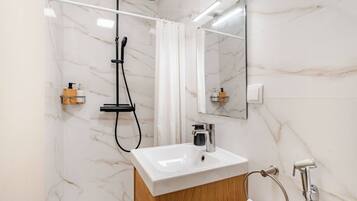 Shower, hair dryer, towels, soap