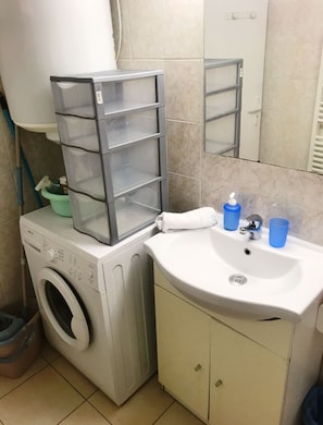 Shower, towels, soap, toilet paper