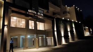 A building with a sign reading "ASHWA GLOOR" at night. - Ashwa Glory Retreat (Igatpuri)